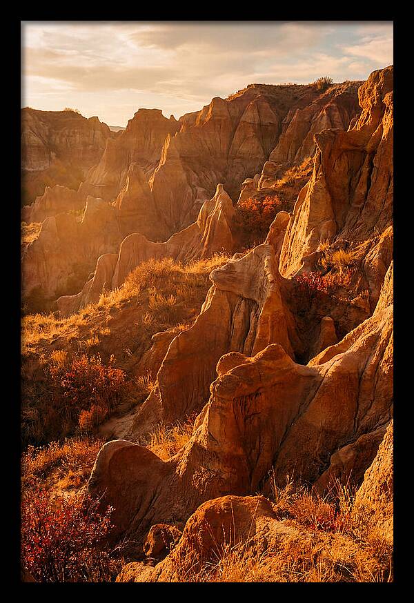 Eroded Mudstone Formations At Sunset
