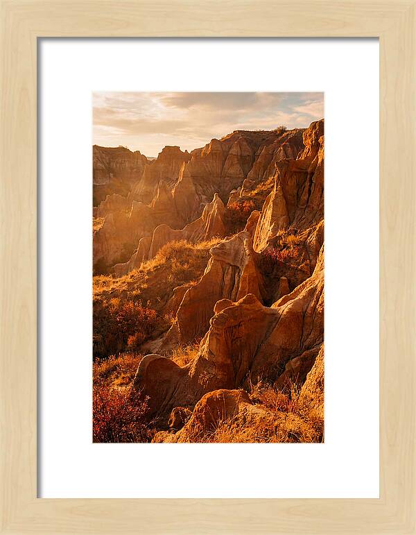 Eroded Mudstone Formations At Sunset