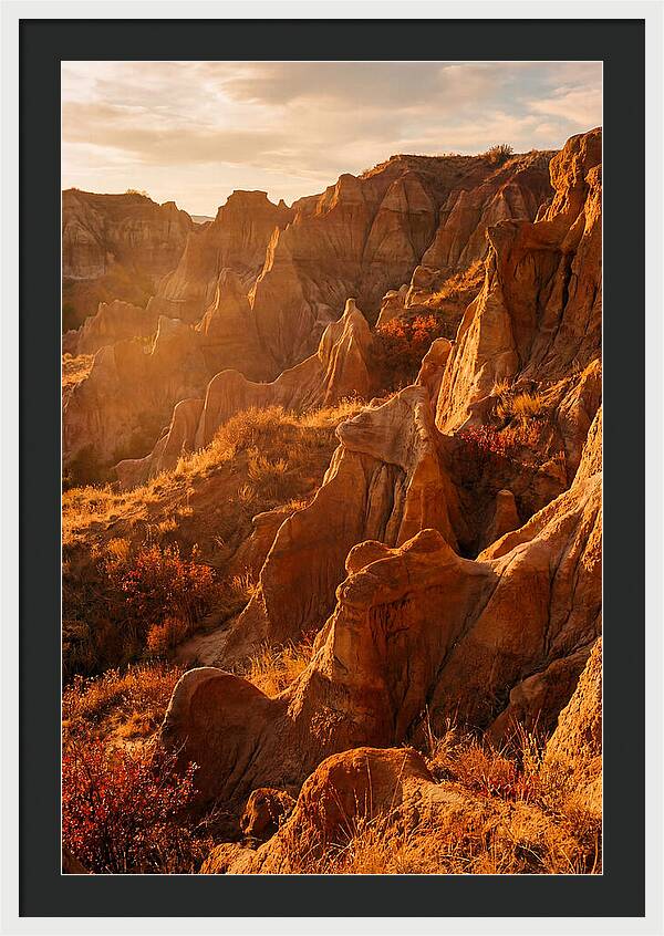 Eroded Mudstone Formations At Sunset