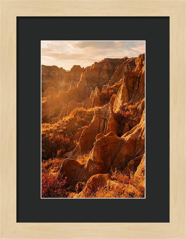 Eroded Mudstone Formations At Sunset