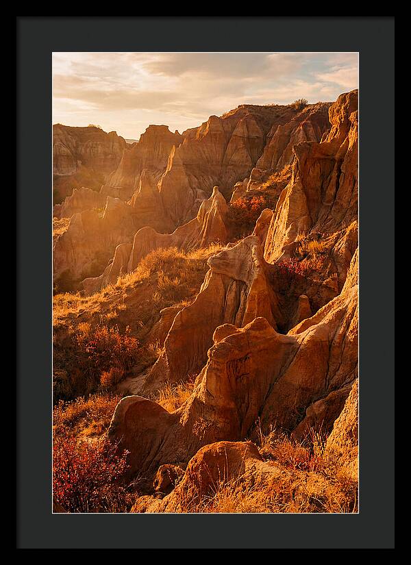 Eroded Mudstone Formations At Sunset