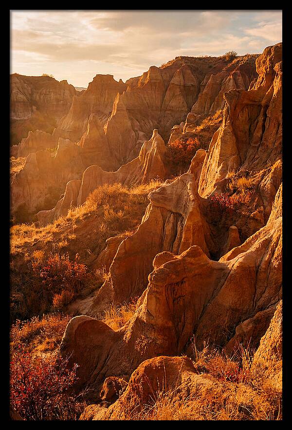 Eroded Mudstone Formations At Sunset