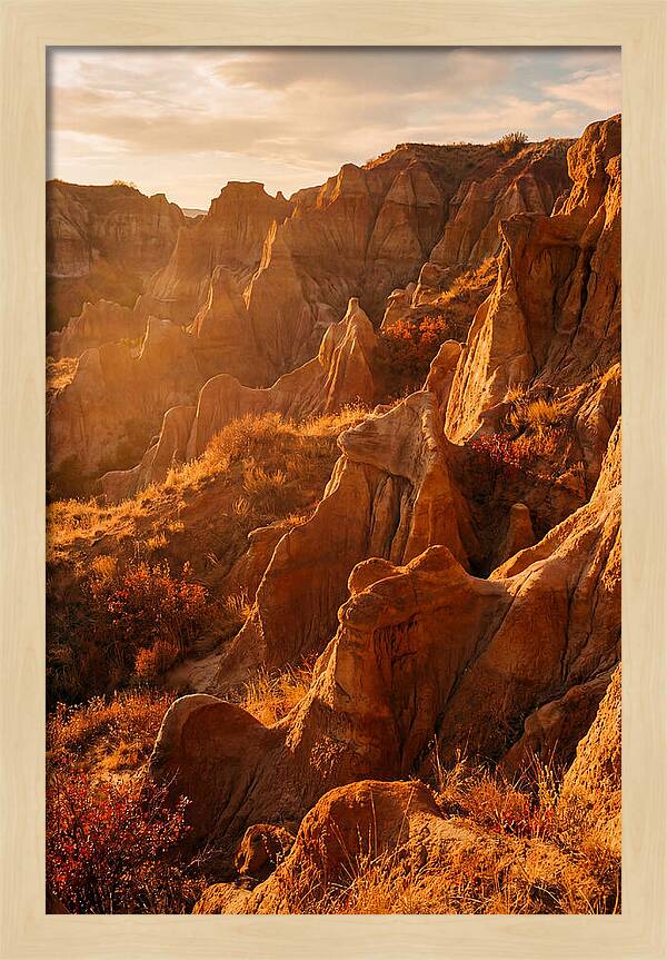Eroded Mudstone Formations At Sunset