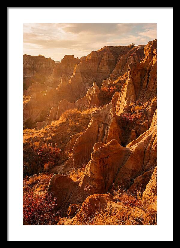Eroded Mudstone Formations At Sunset
