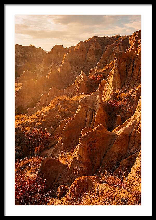 Eroded Mudstone Formations At Sunset