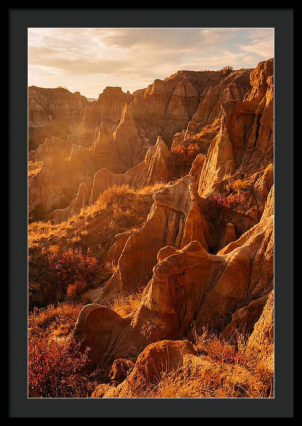 Eroded Mudstone Formations At Sunset