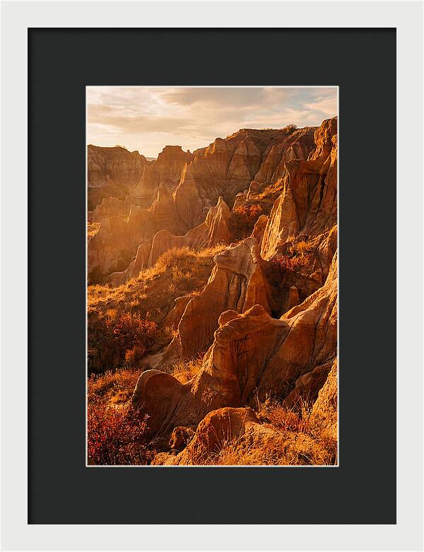 Eroded Mudstone Formations At Sunset
