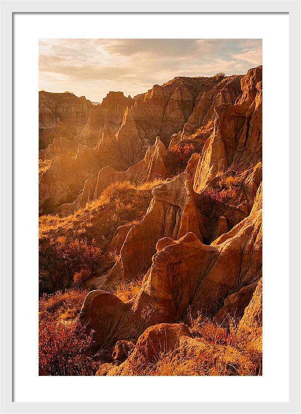 Eroded Mudstone Formations At Sunset