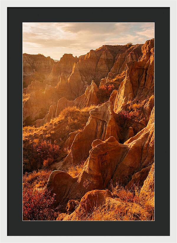 Eroded Mudstone Formations At Sunset