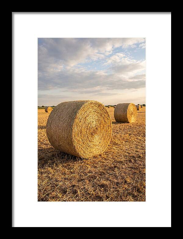 Farm Hay Bales Under Sunset