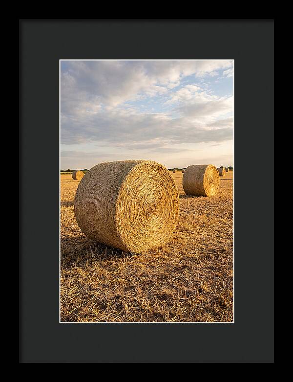 Farm Hay Bales Under Sunset