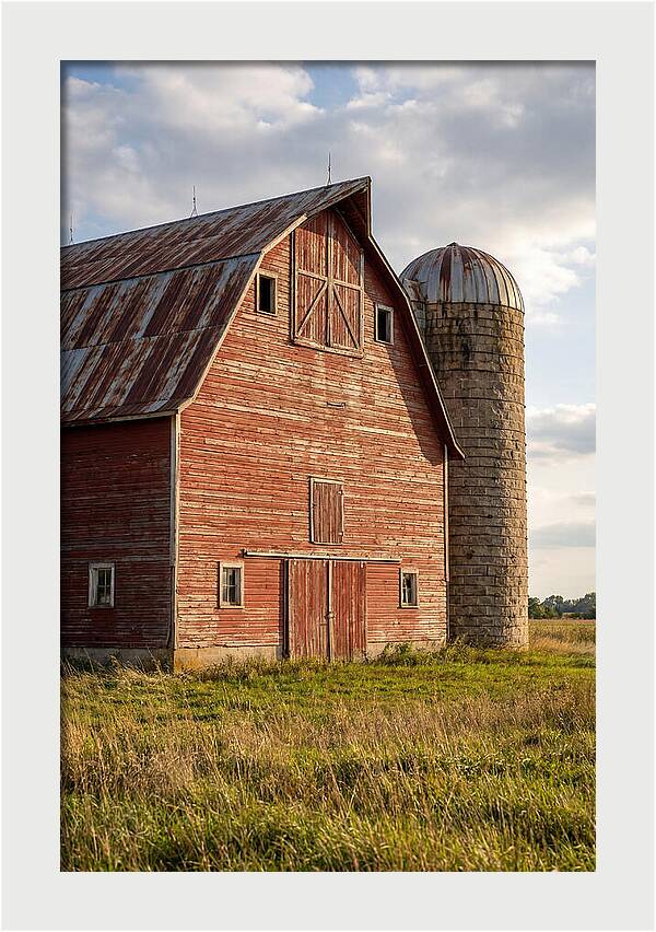 Farmhouse Charm In Rustic Landscape