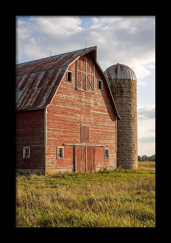 Farmhouse Charm In Rustic Landscape