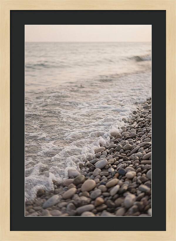 Gentle Waves Lapping On Pebble Beach