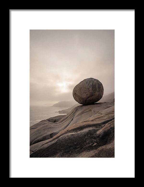 Glacial Erratic Balancing Above Waves