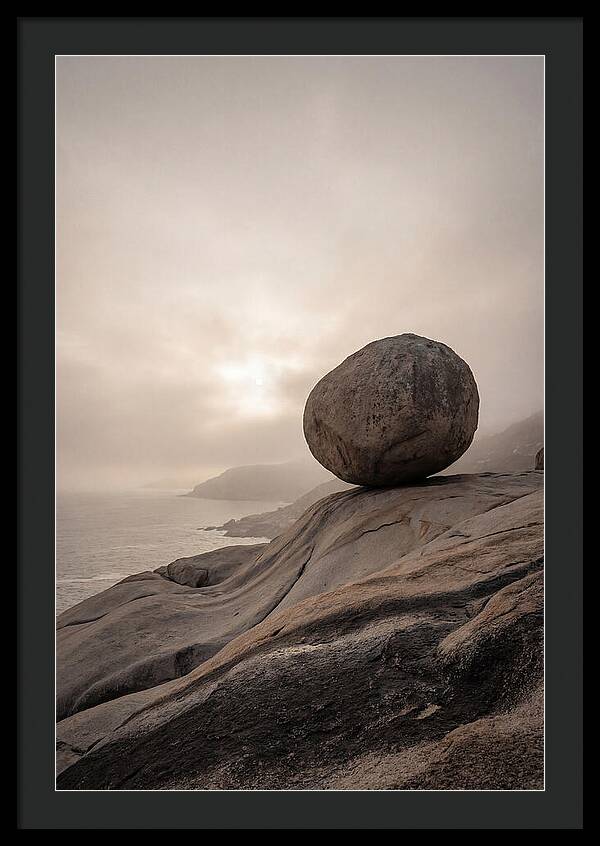 Glacial Erratic Balancing Above Waves