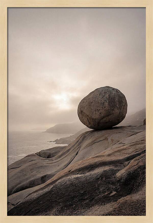Glacial Erratic Balancing Above Waves