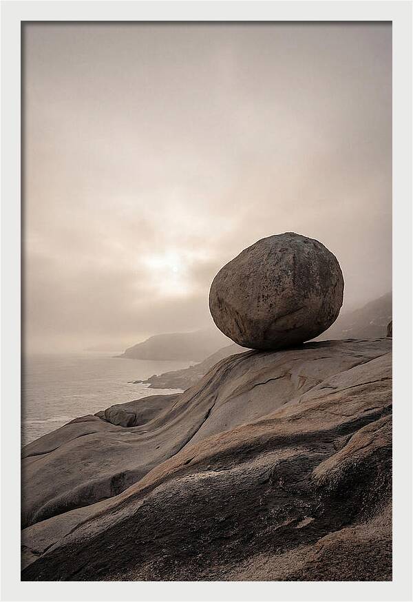 Glacial Erratic Balancing Above Waves
