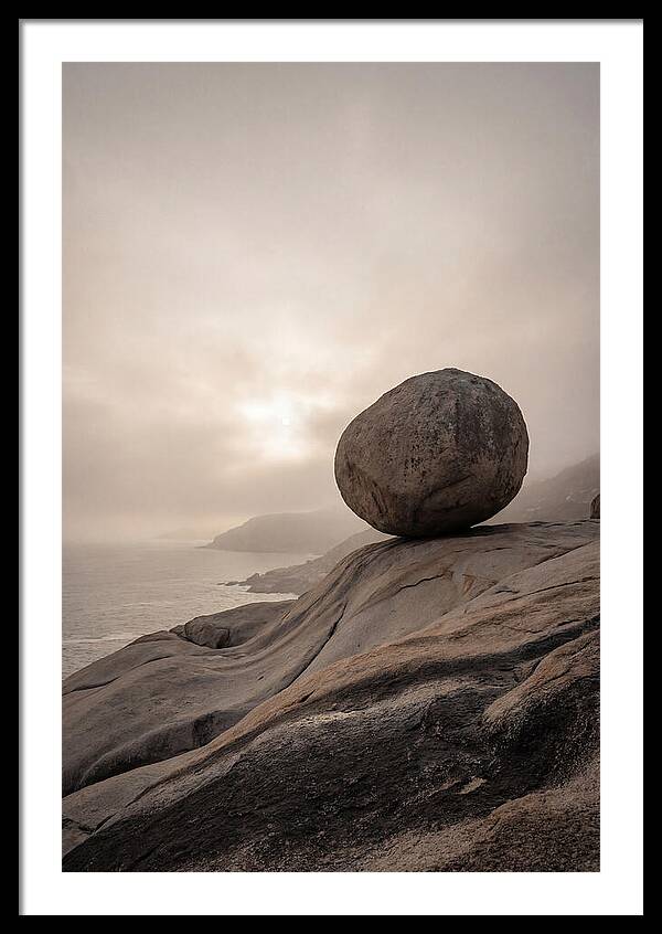 Glacial Erratic Balancing Above Waves
