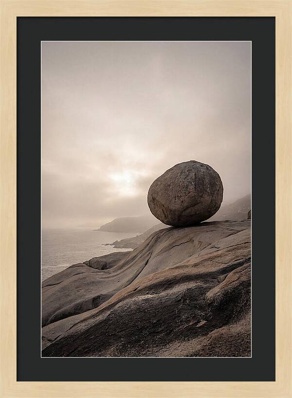 Glacial Erratic Balancing Above Waves