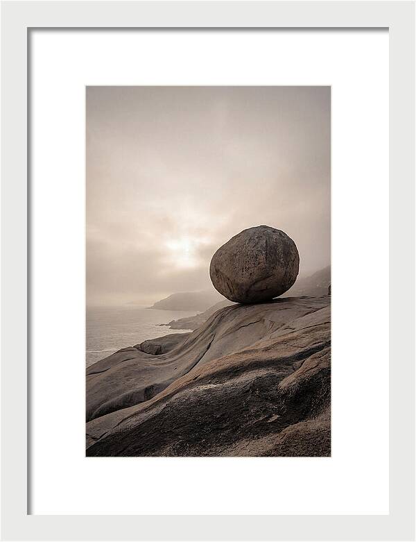 Glacial Erratic Balancing Above Waves