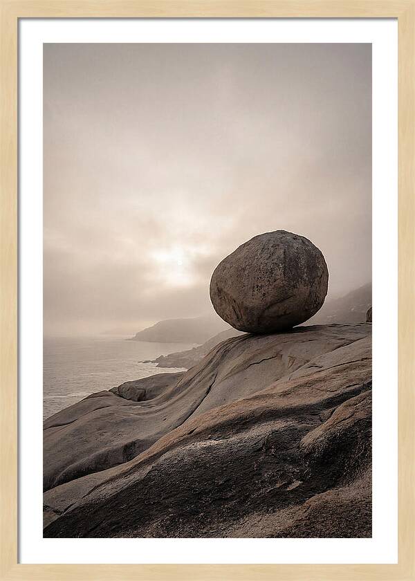 Glacial Erratic Balancing Above Waves