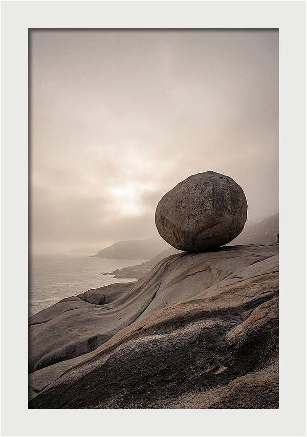 Glacial Erratic Balancing Above Waves