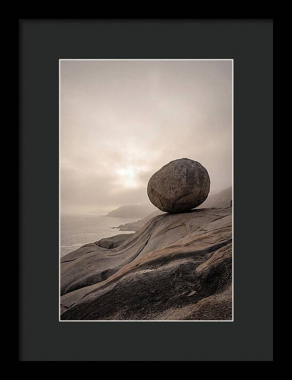 Glacial Erratic Balancing Above Waves