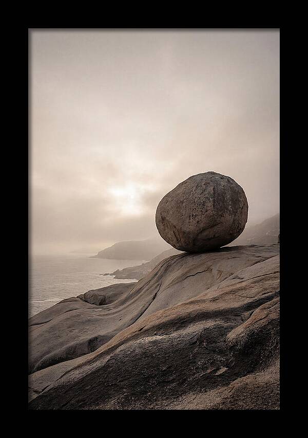 Glacial Erratic Balancing Above Waves