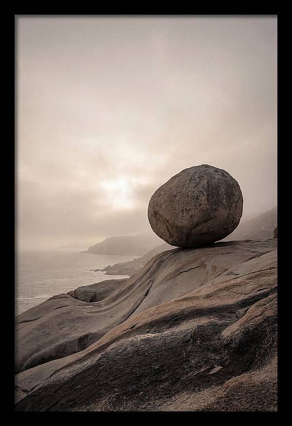 Glacial Erratic Balancing Above Waves