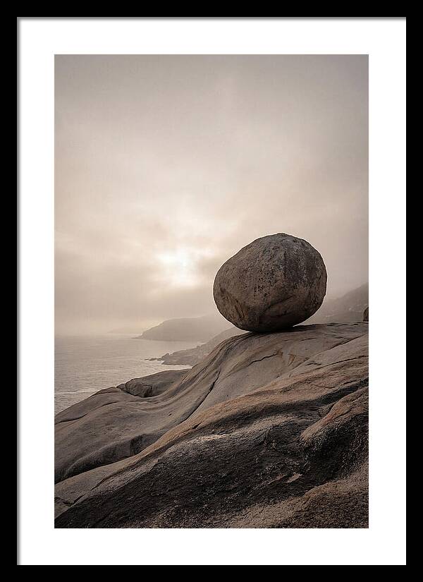 Glacial Erratic Balancing Above Waves