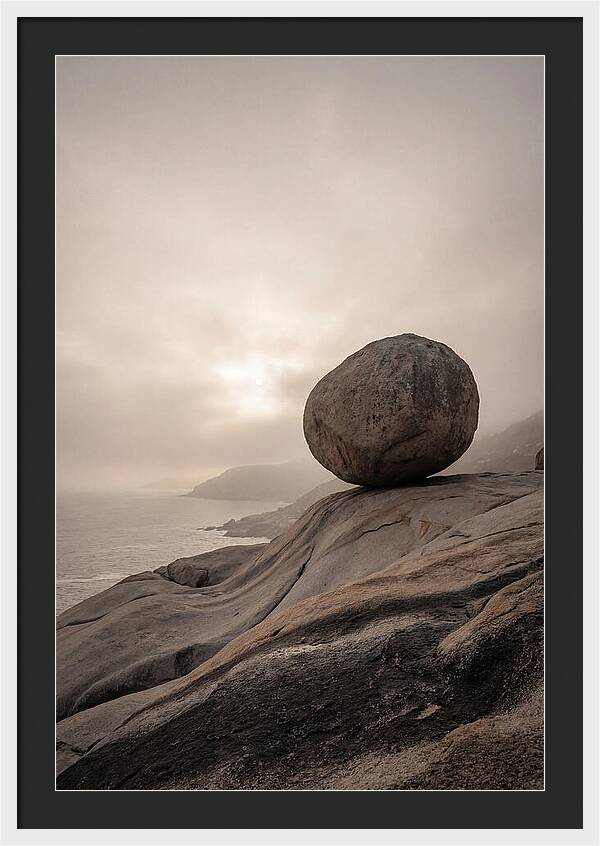 Glacial Erratic Balancing Above Waves