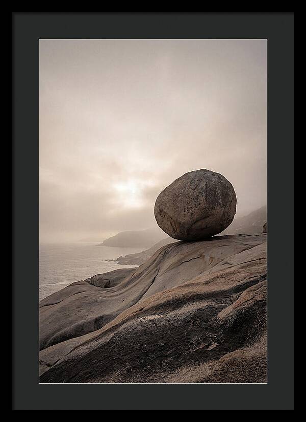 Glacial Erratic Balancing Above Waves