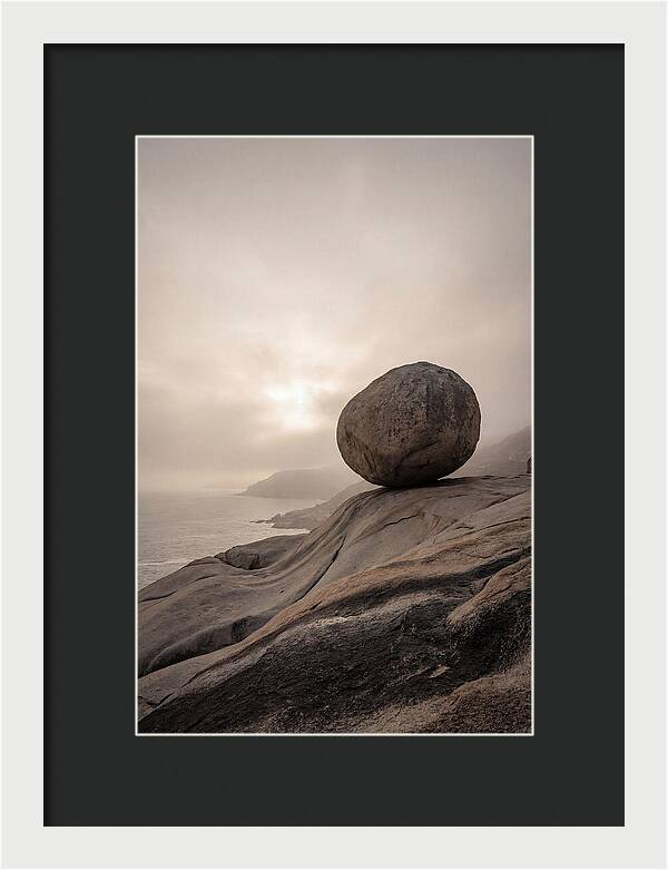 Glacial Erratic Balancing Above Waves