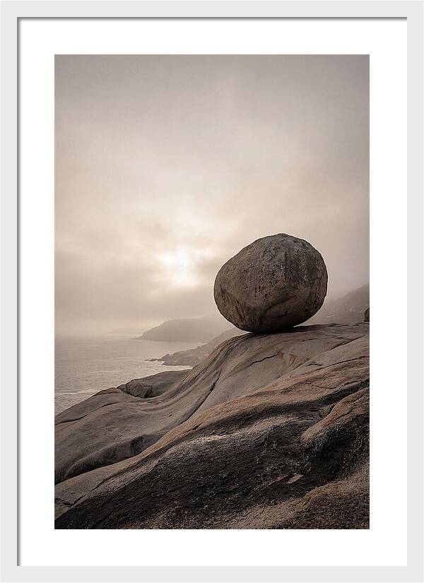 Glacial Erratic Balancing Above Waves