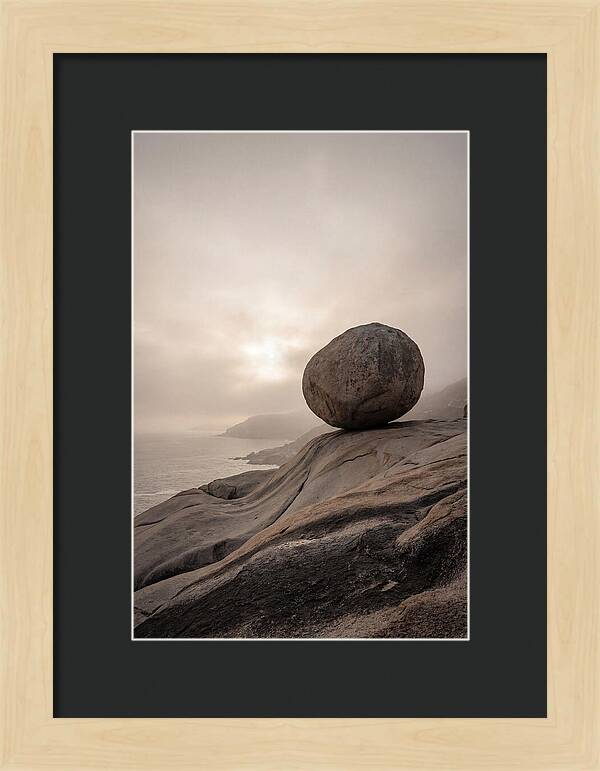 Glacial Erratic Balancing Above Waves