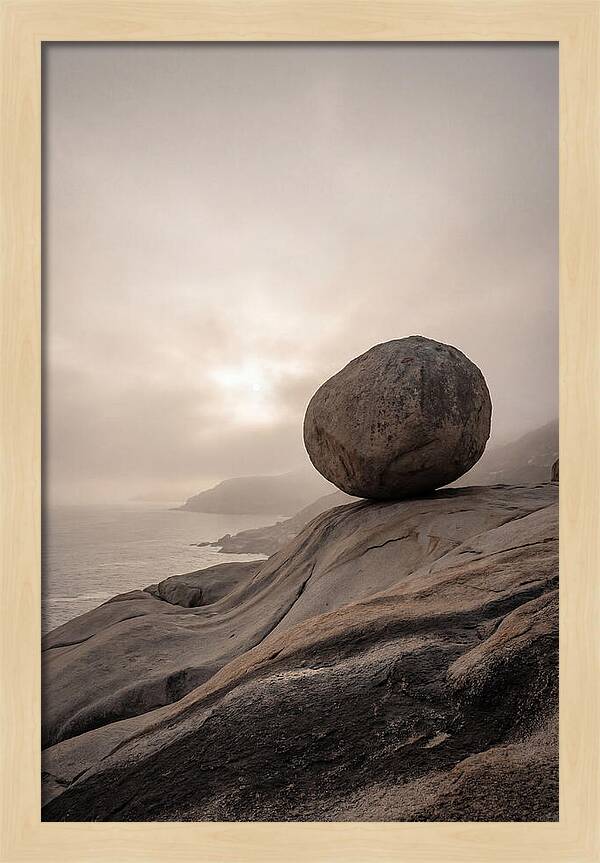 Glacial Erratic Balancing Above Waves