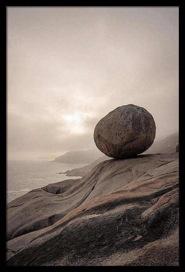 Glacial Erratic Balancing Above Waves