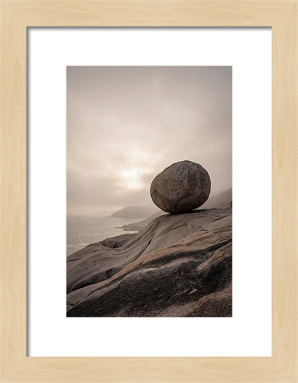 Glacial Erratic Balancing Above Waves