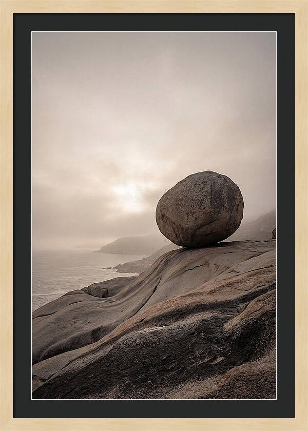 Glacial Erratic Balancing Above Waves