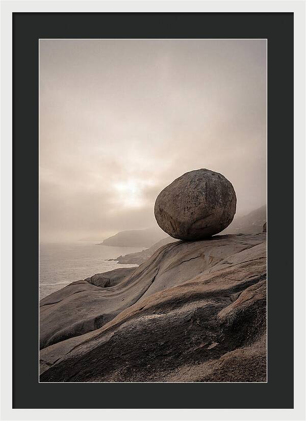 Glacial Erratic Balancing Above Waves