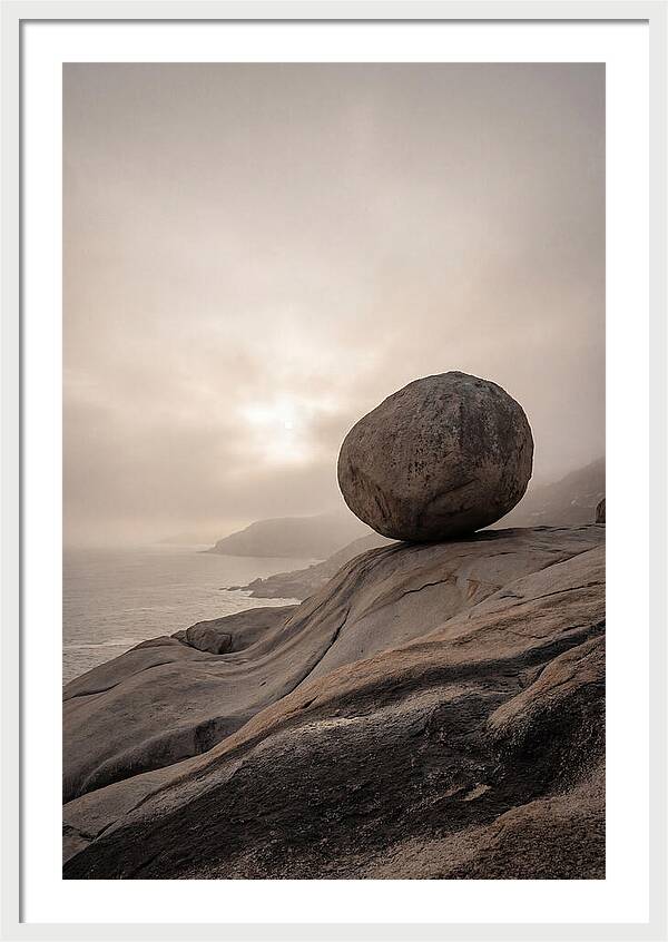 Glacial Erratic Balancing Above Waves