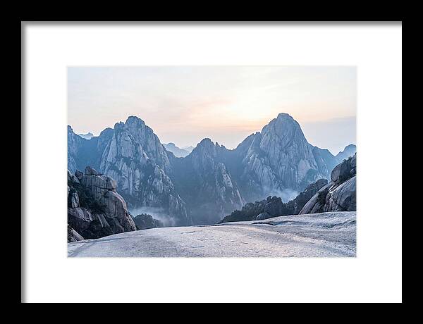 Granite Peaks Piercing Pale Sky
