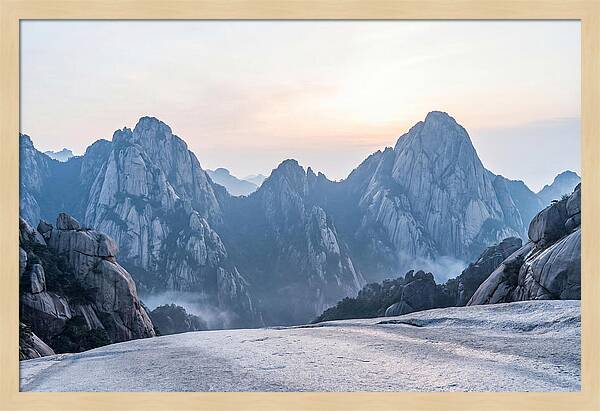 Granite Peaks Piercing Pale Sky