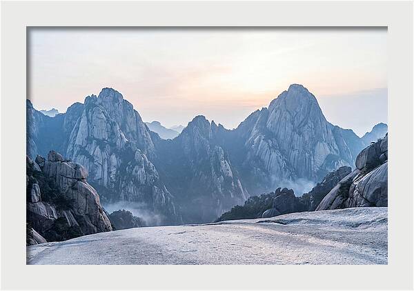 Granite Peaks Piercing Pale Sky