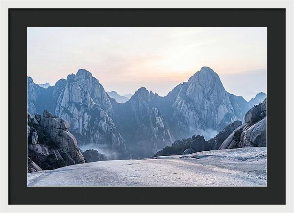 Granite Peaks Piercing Pale Sky