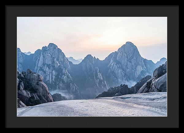 Granite Peaks Piercing Pale Sky