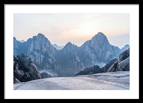 Granite Peaks Piercing Pale Sky