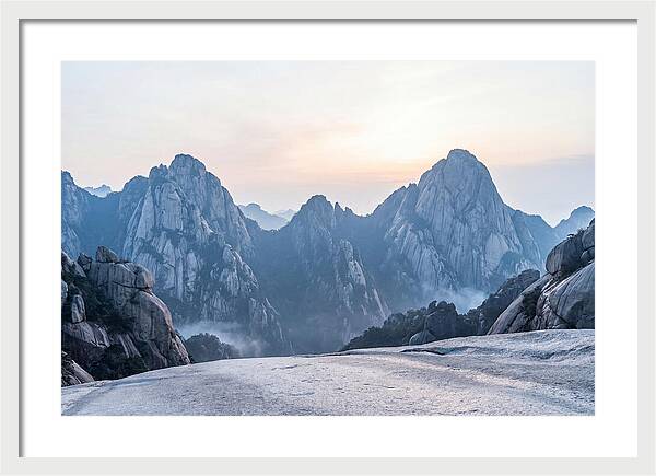 Granite Peaks Piercing Pale Sky