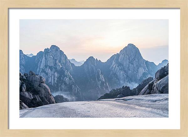 Granite Peaks Piercing Pale Sky